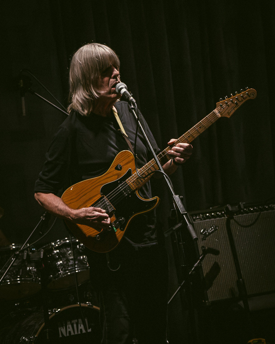 A guitarist playing in the evening jam