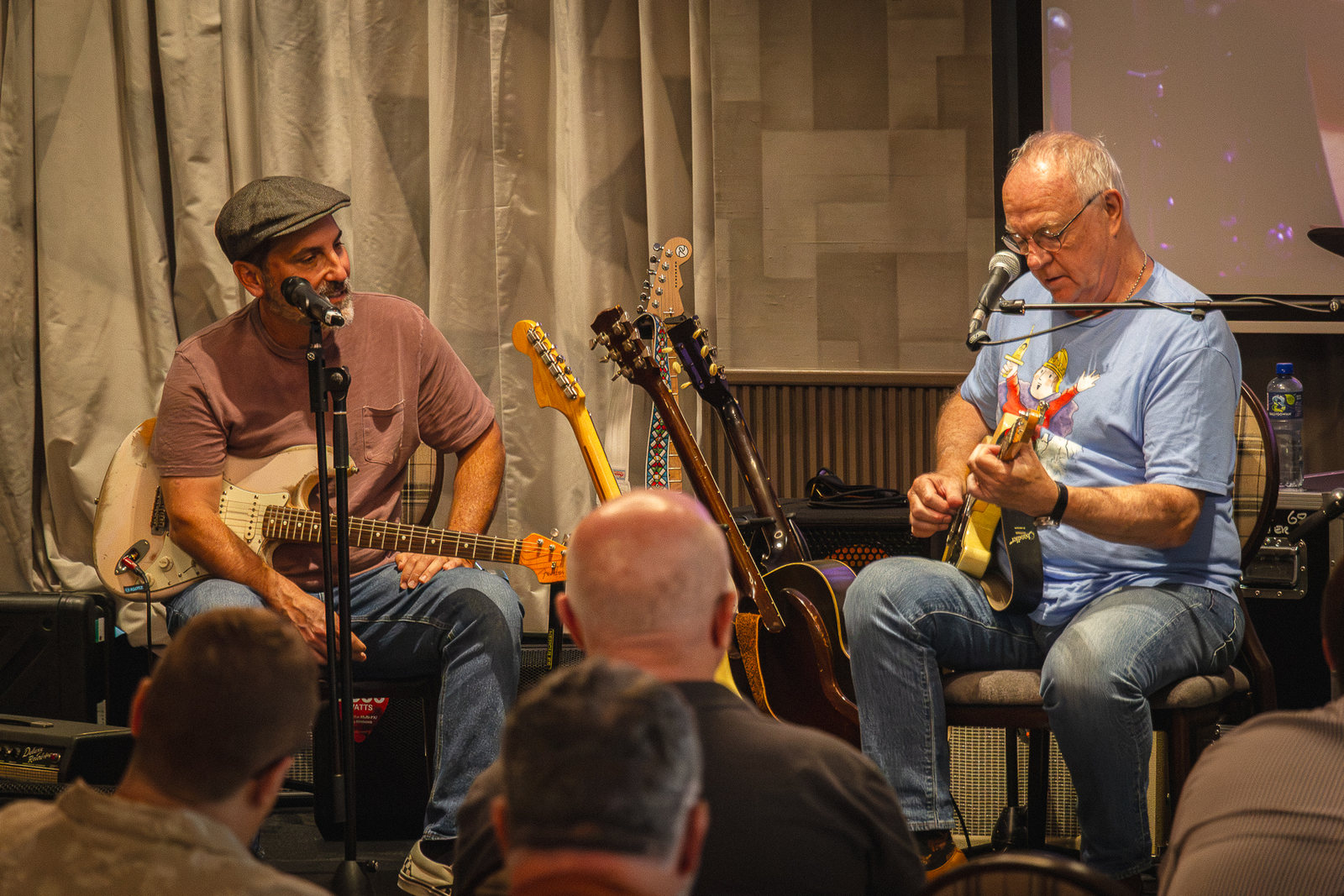 Two artists playing to an audience during a session