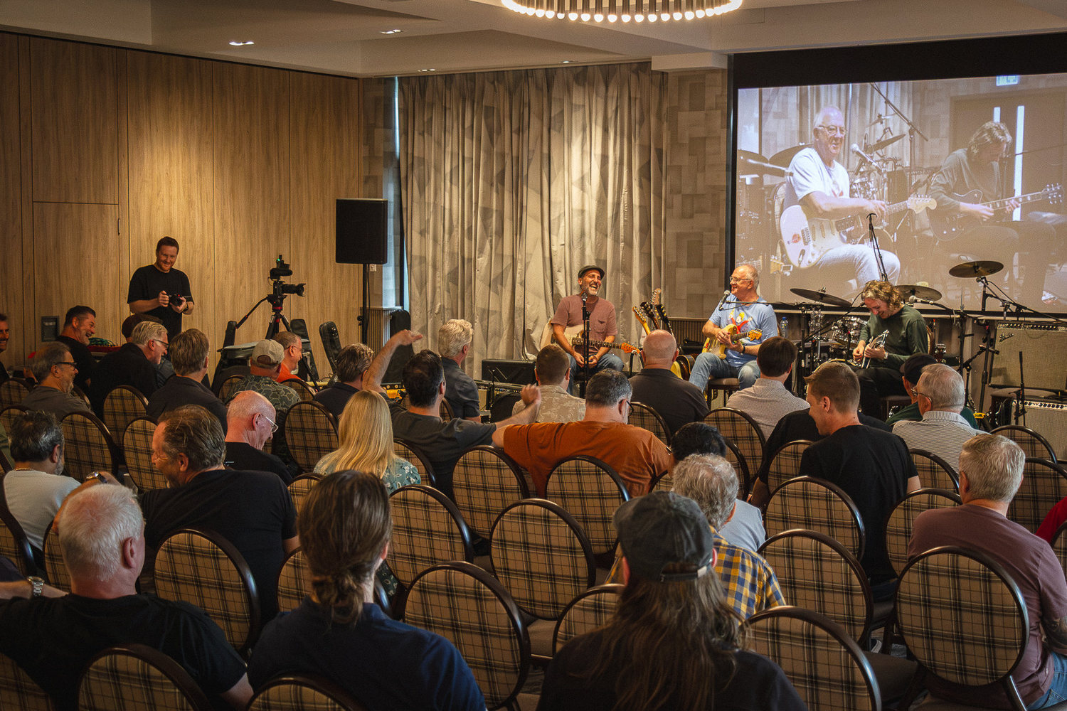 Guests seated close to the stage during a workshop
