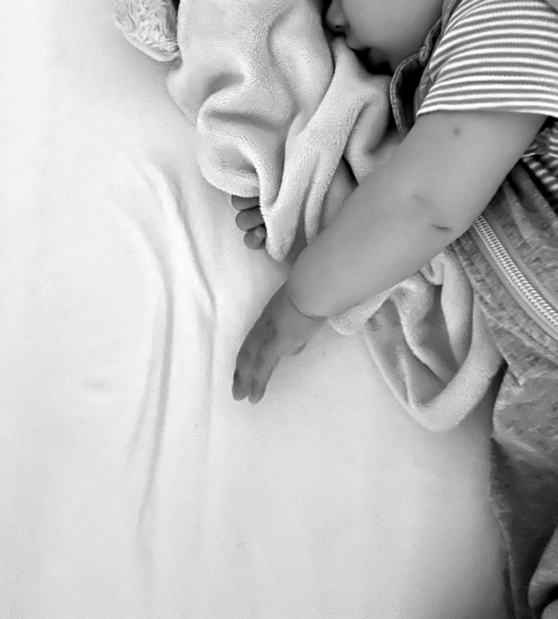 Baby asleep with a comforter