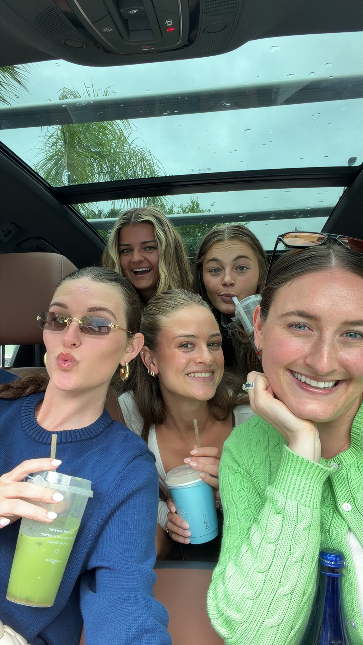 Five women from The Creator Current laughing together in a car, holding drinks