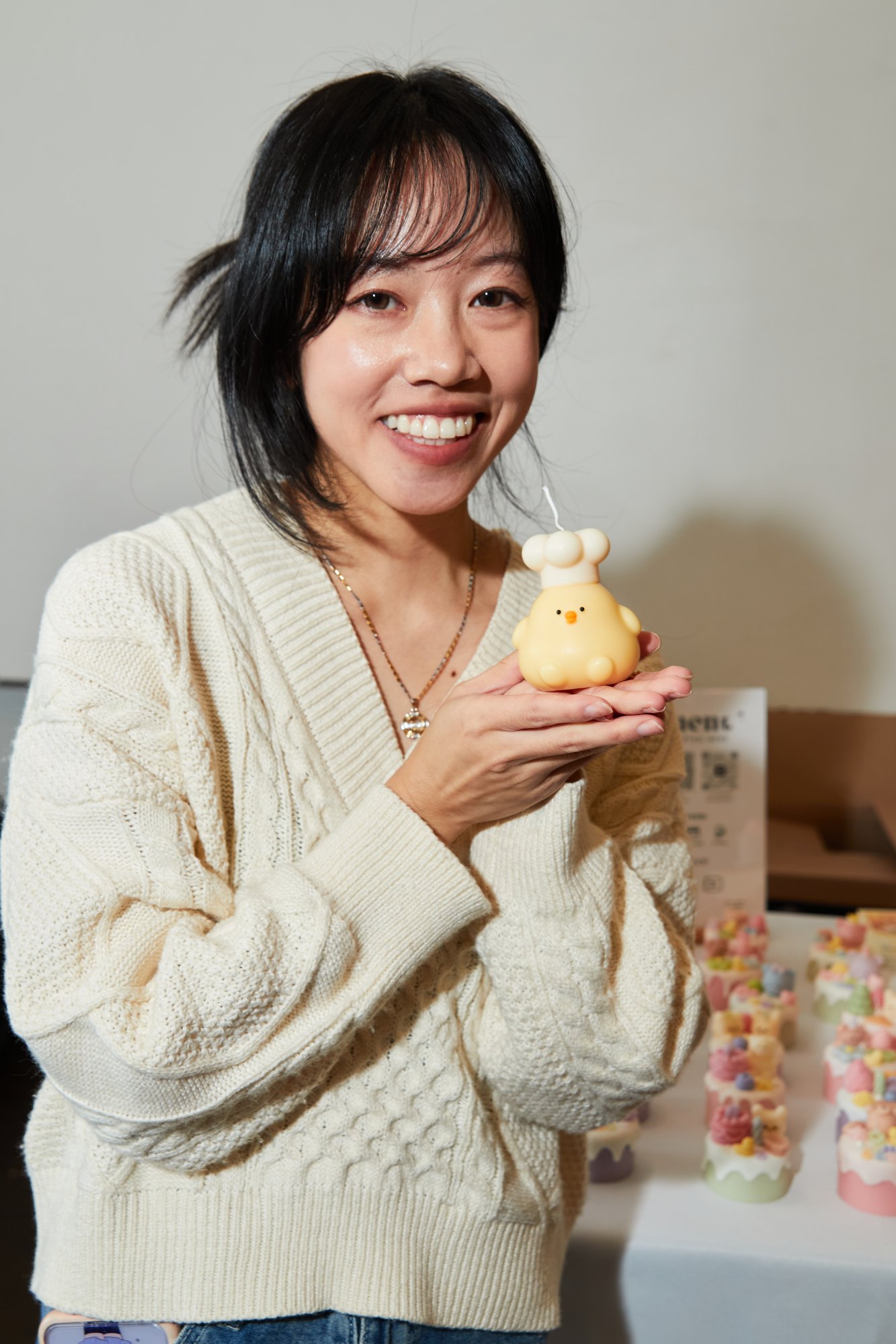 Jessica Tsang holding a cake candle