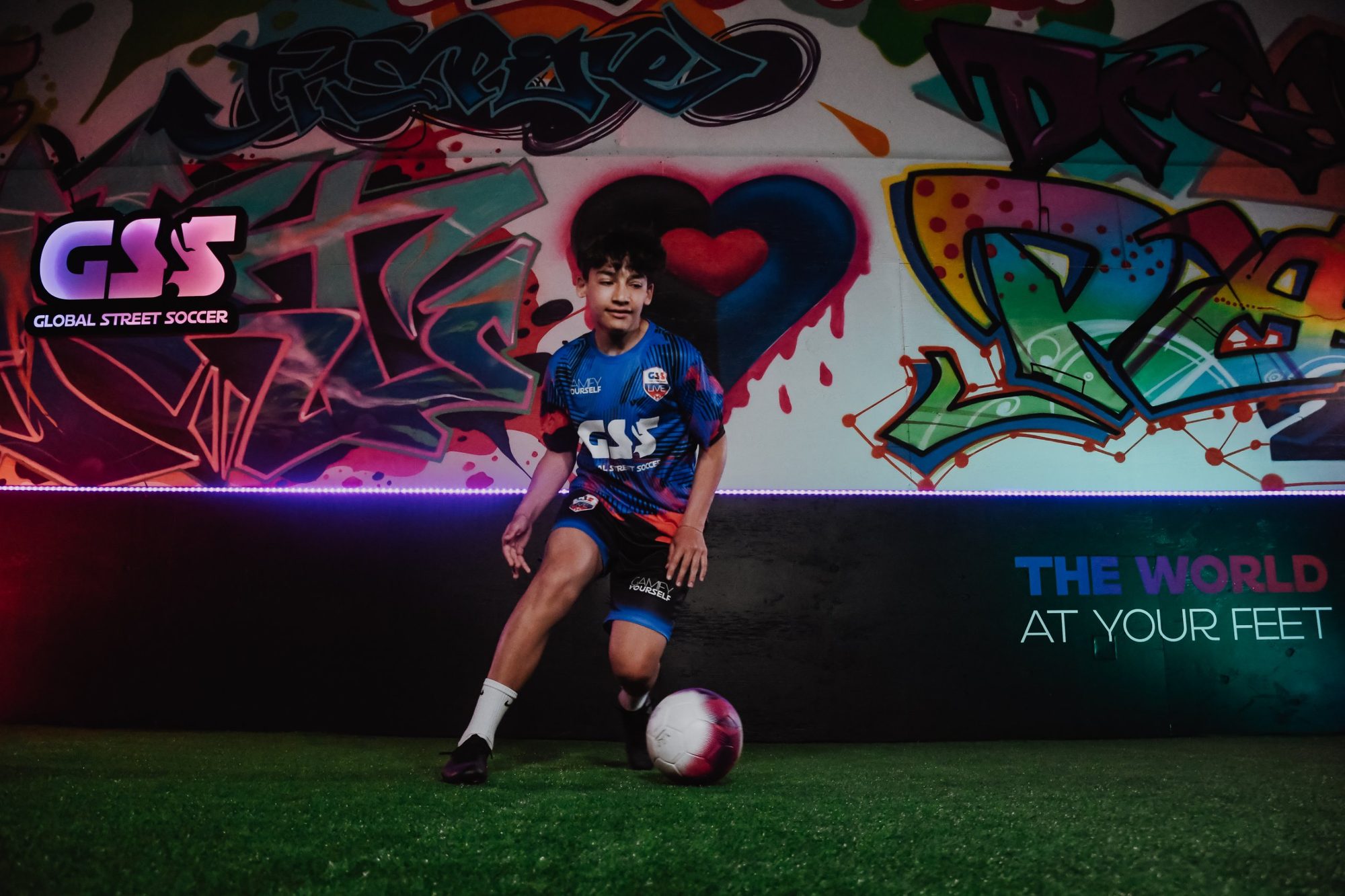 A young player dribbling in the GSS studio