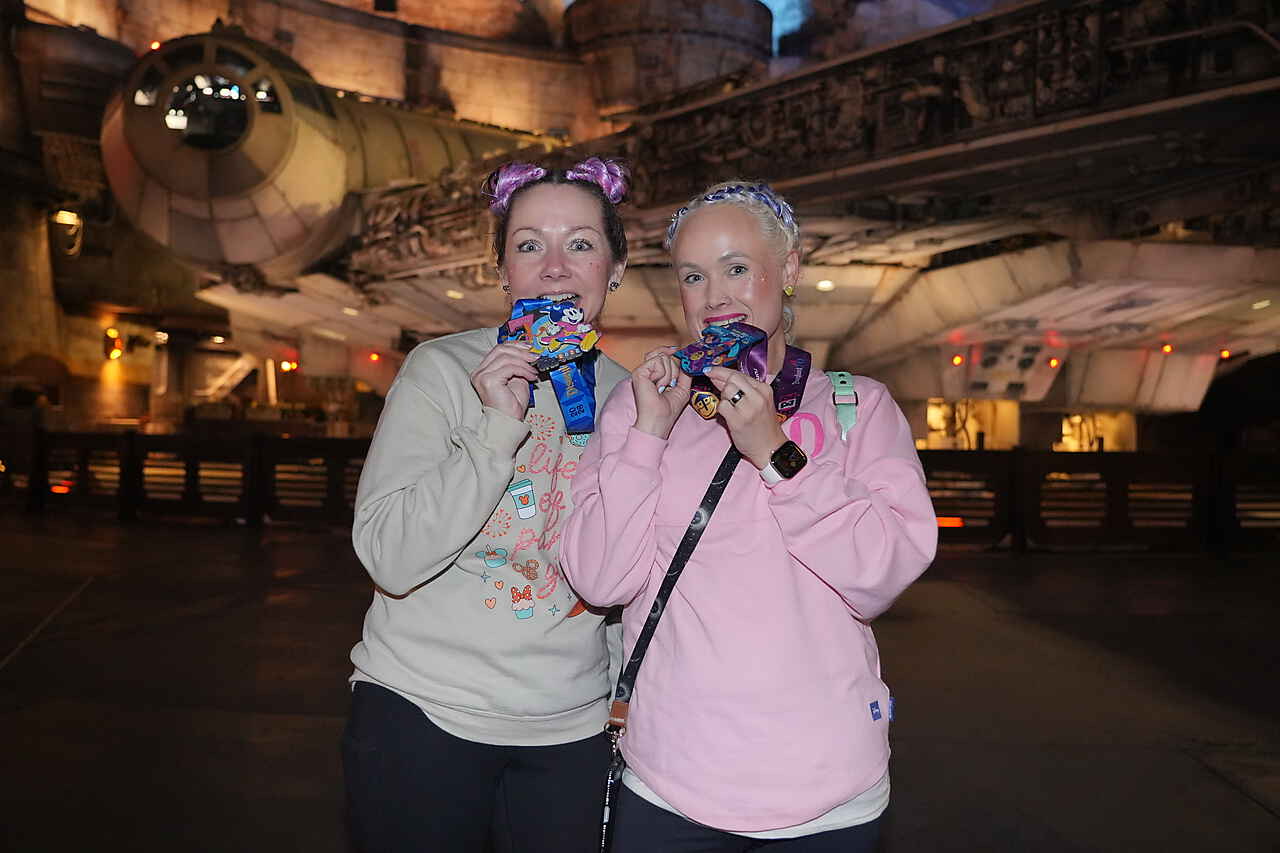 Myranda and a friend celebrating with their race medals