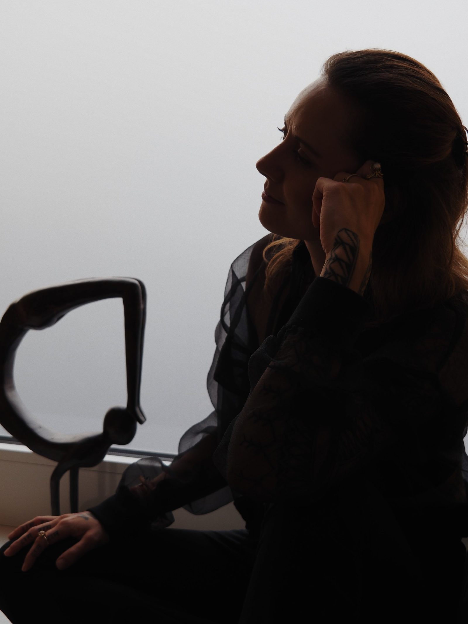 Alexia in silhouette by the window
