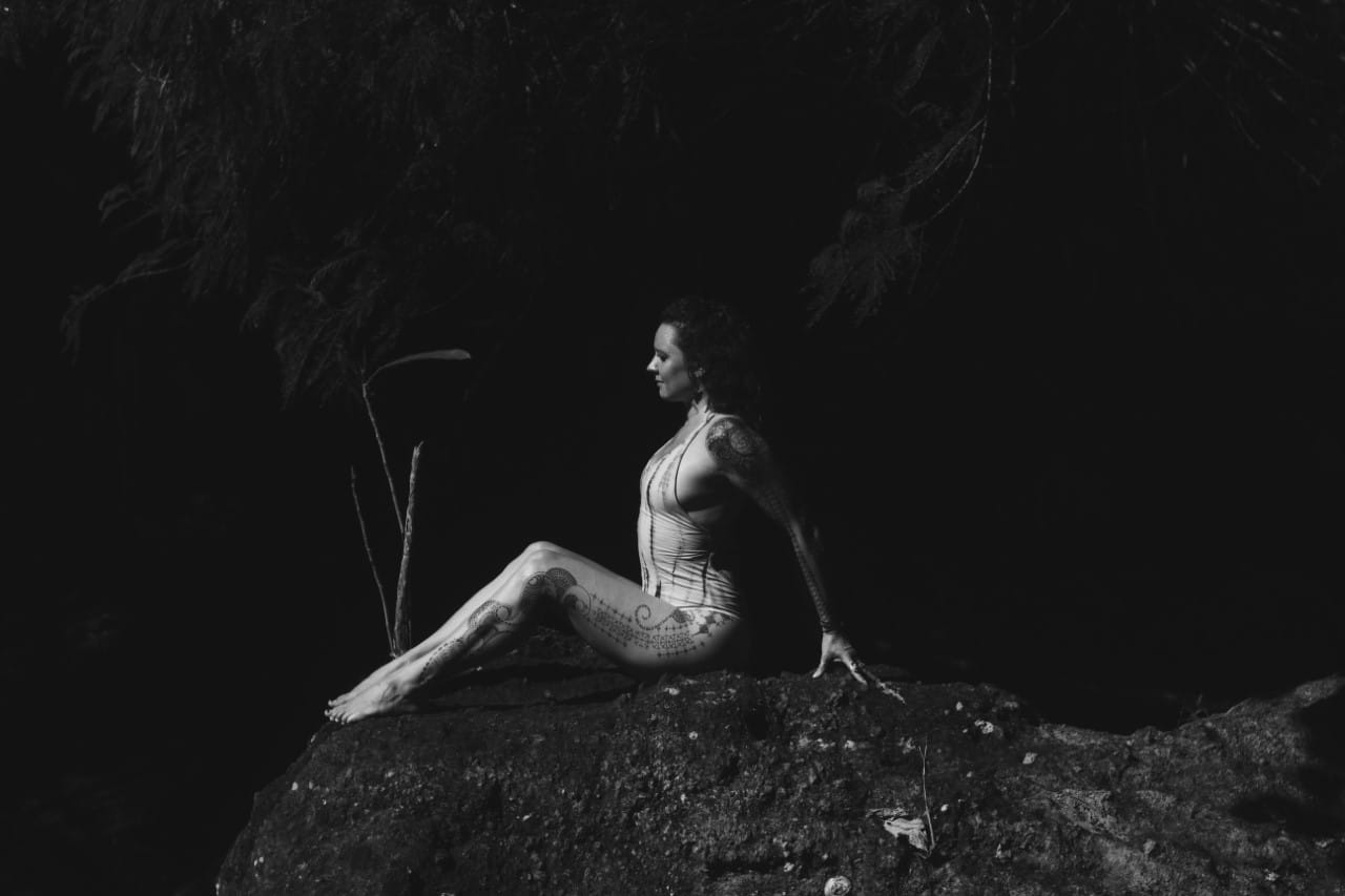 Alexia sitting on the stones