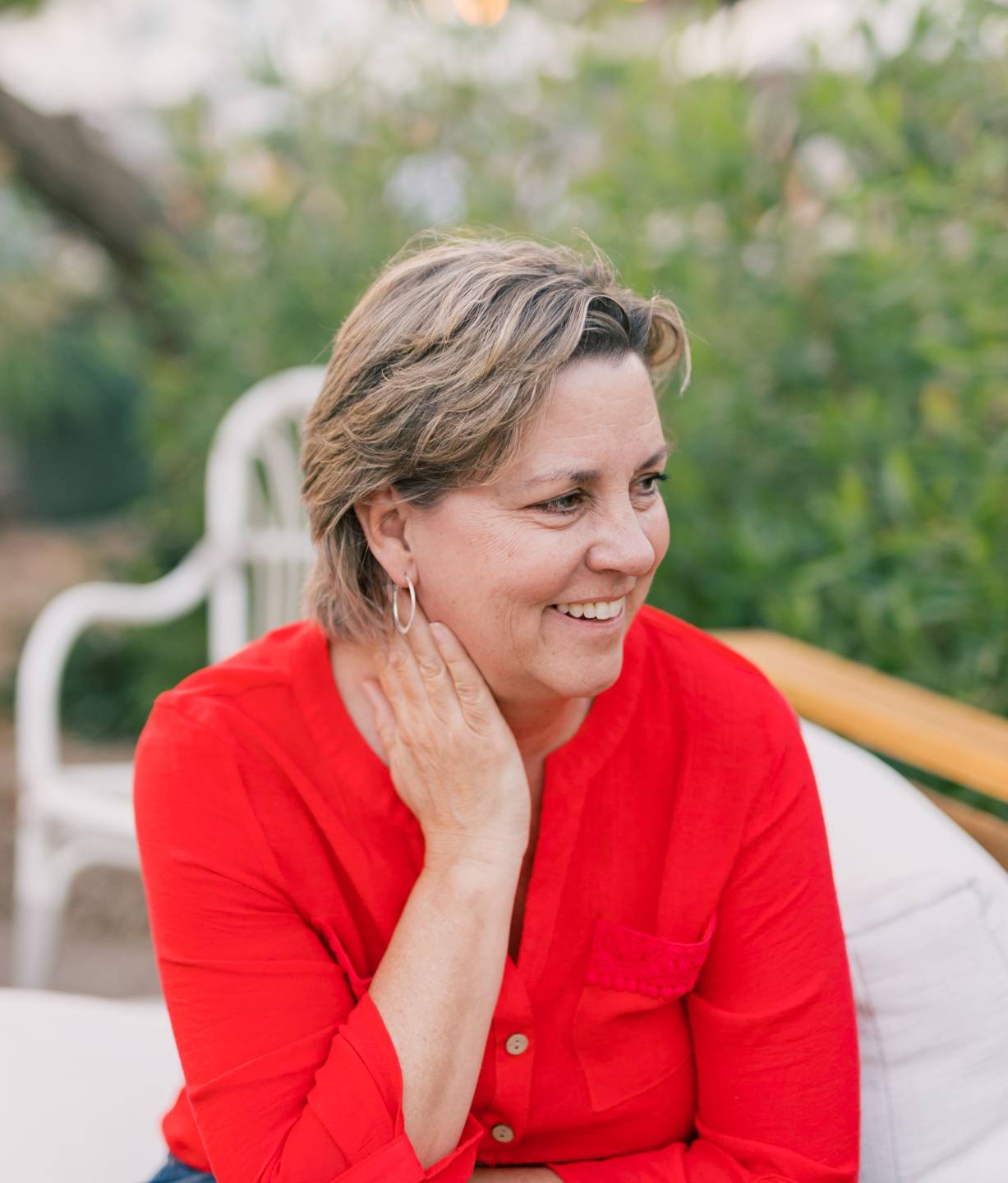 Kimberly Potter, RN, BSN, smiling in a red blouse