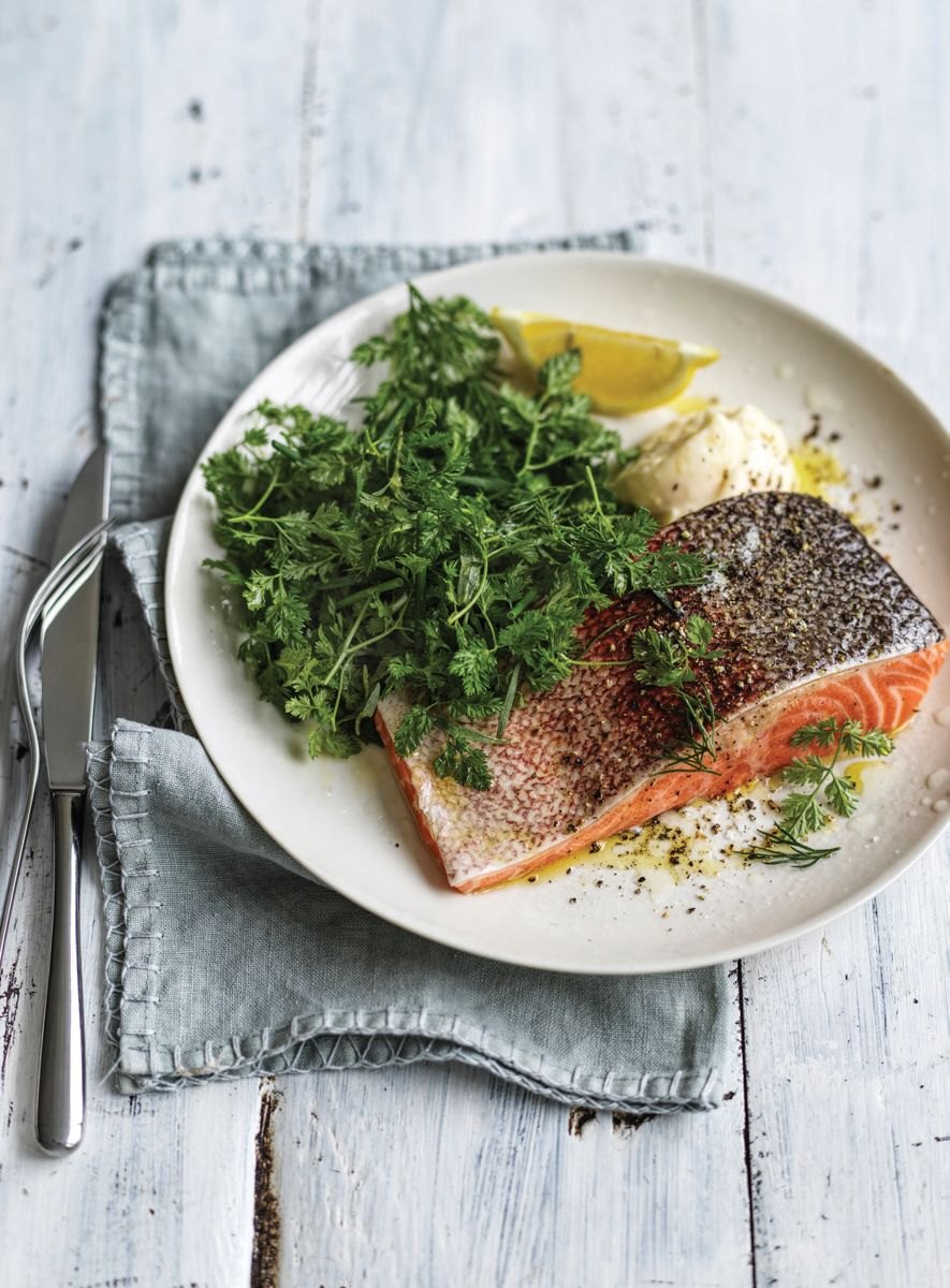 Poached salmon with soft herbs