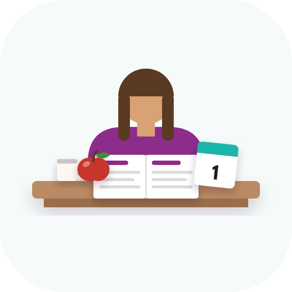 A teacher at her desk with an open plan book