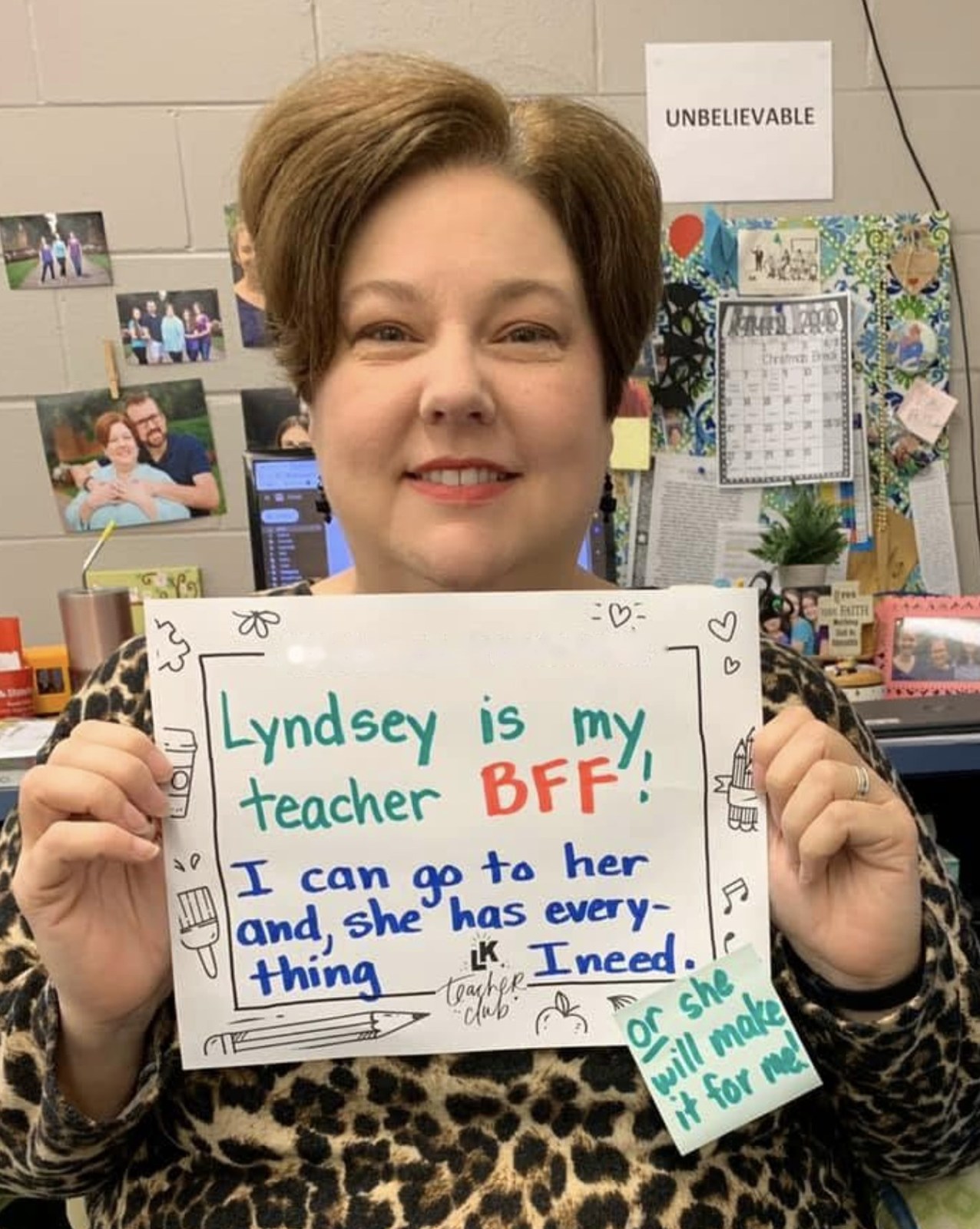 Misty holding a handwritten #teacherclublove sign