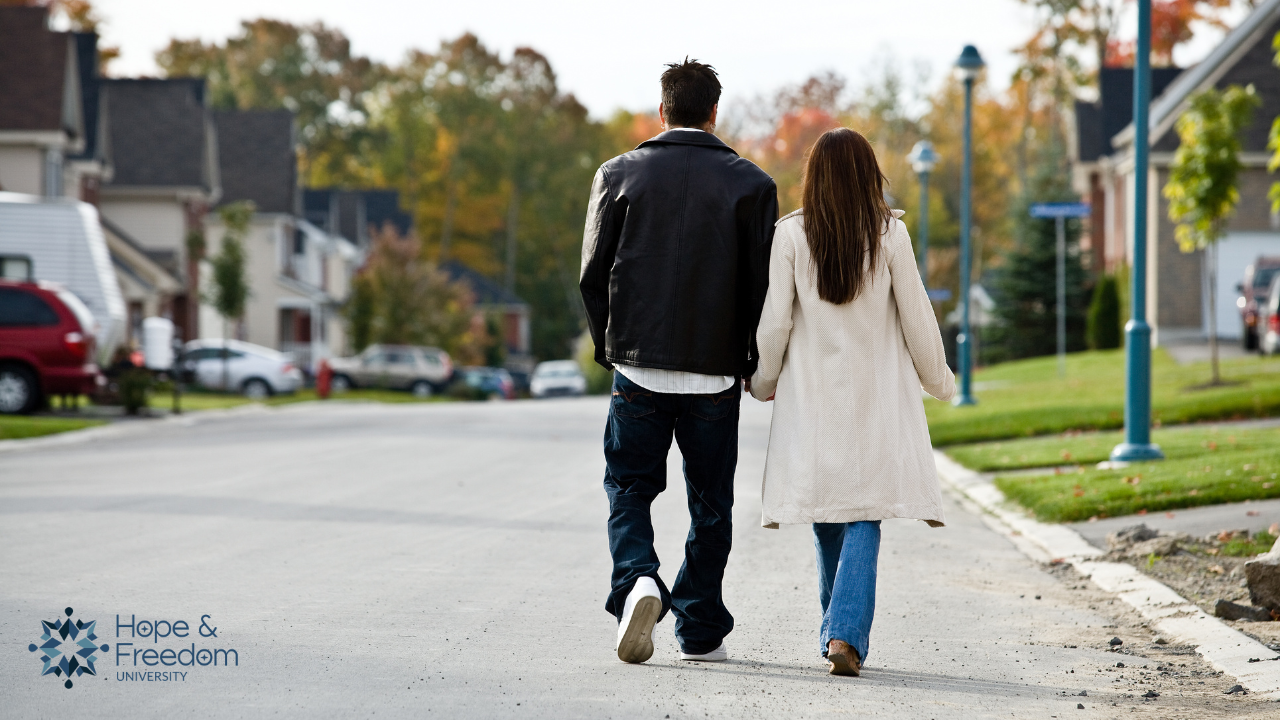 couple in recovery from sex addiction and betrayal trauma taking a walk together