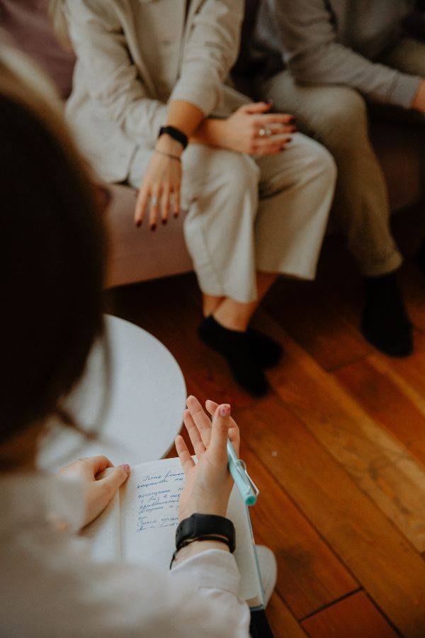 man and woman with therapist