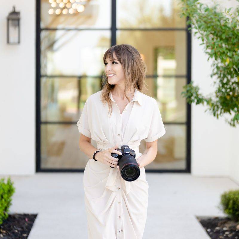 Vanessa Joy holding her camera outside