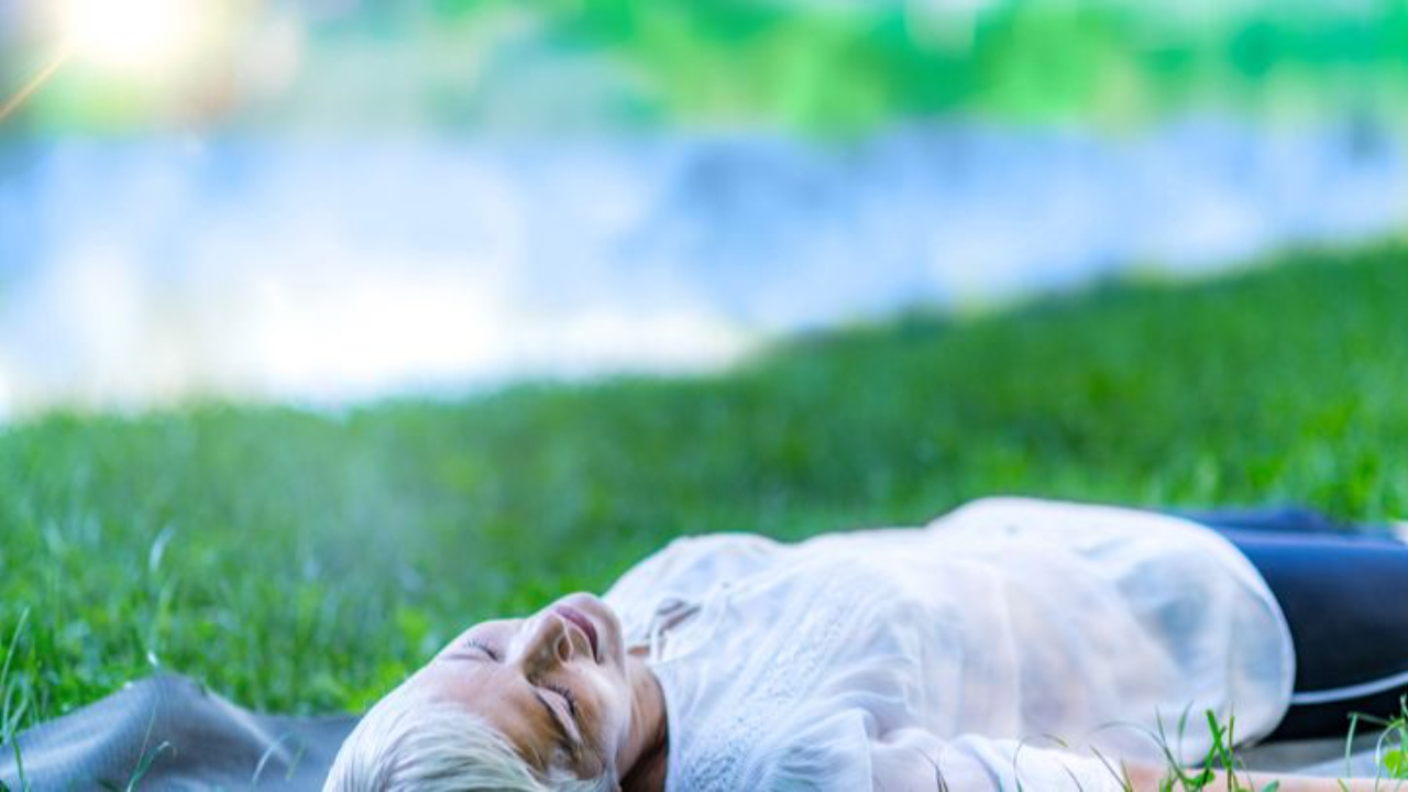 This woman is listening to her body and relaxing