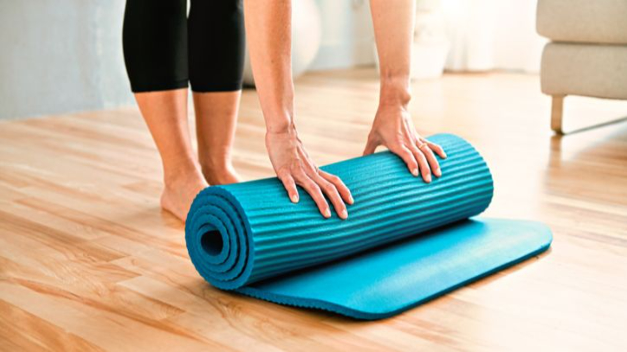 This person is empowering themselves by preapring to do a Pilates session on the mat