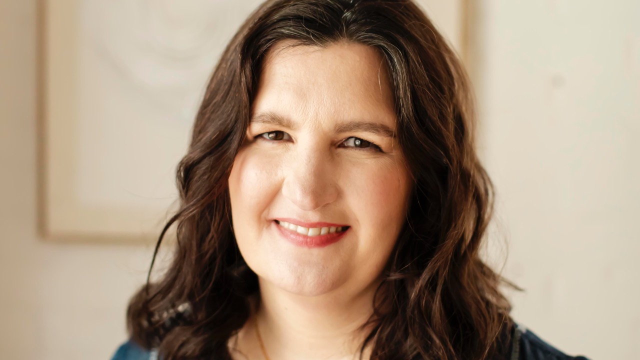 Tina, The Social Sales Girls member success coach, smiling in a blue embroidered blouse. She shares her ecommerce email list growth case study.