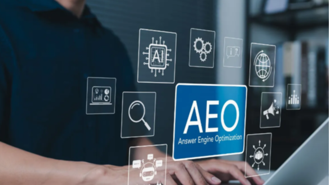 Person using a laptop with an AEO (Answer Engine Optimization) graphic and AI search icons representing ecommerce search optimization.