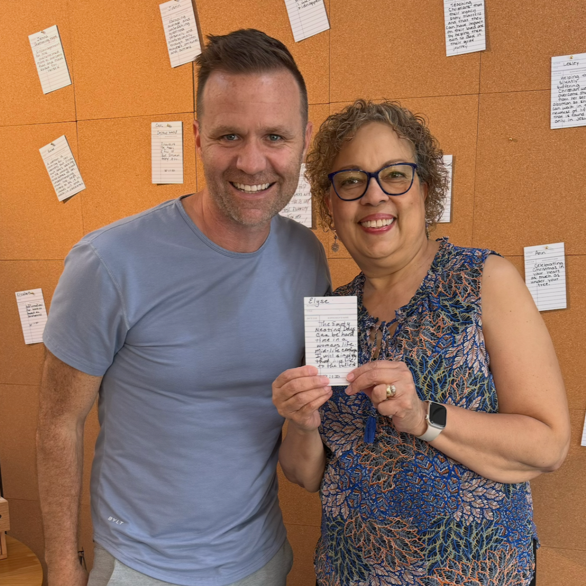 Brian Dixon with a writer holding a note card