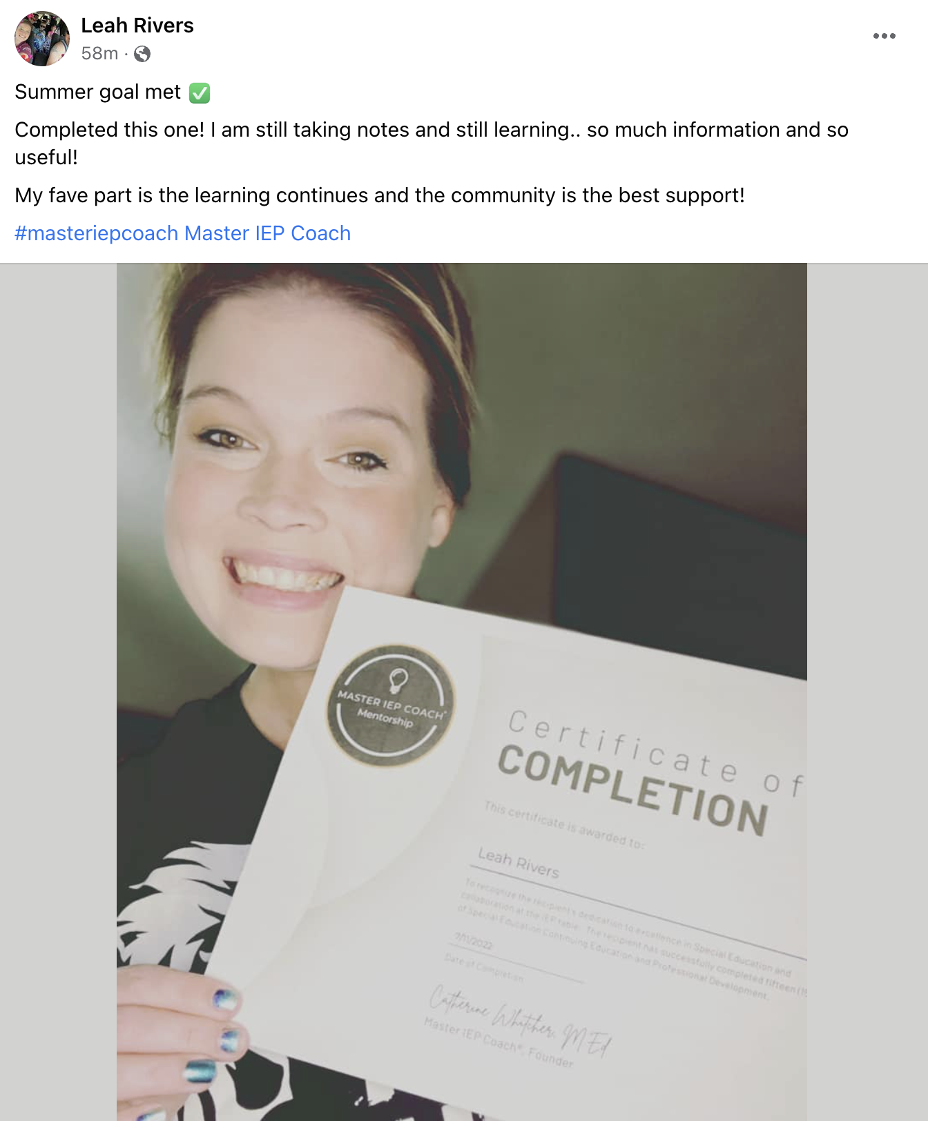 Leah Rivers holding her certificate of completion