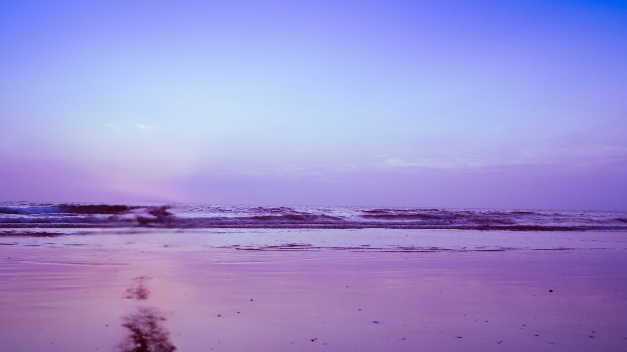 secluded beach scene with light purple skies