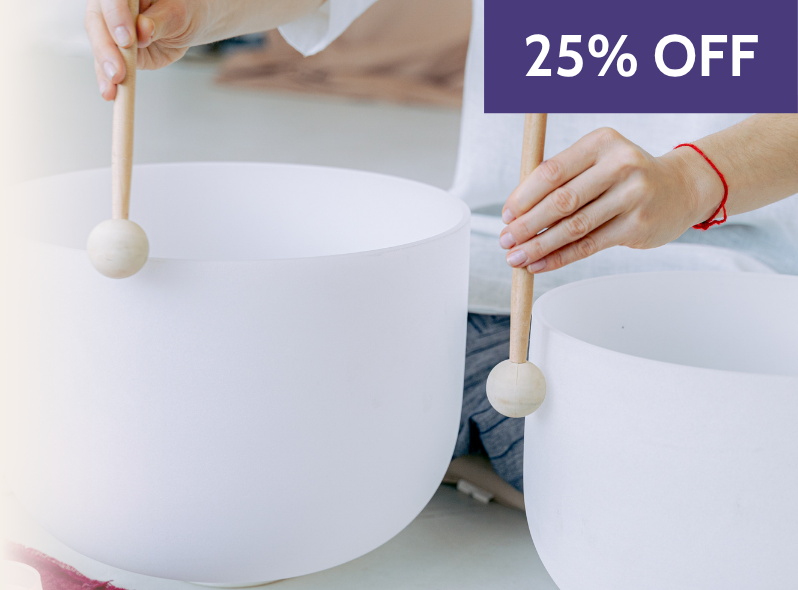 Sound healing practitioner using crystal singing bowls