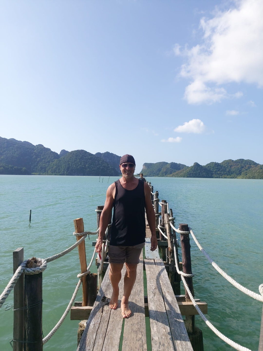 Gabe standing on a Khanom lagoon jetty