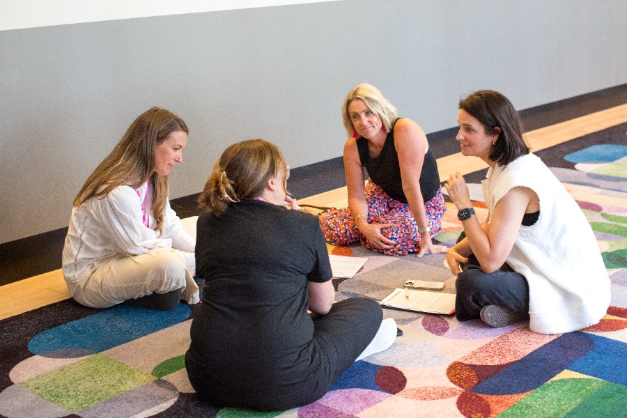 Members working together at a Her Empire Builder planning day
