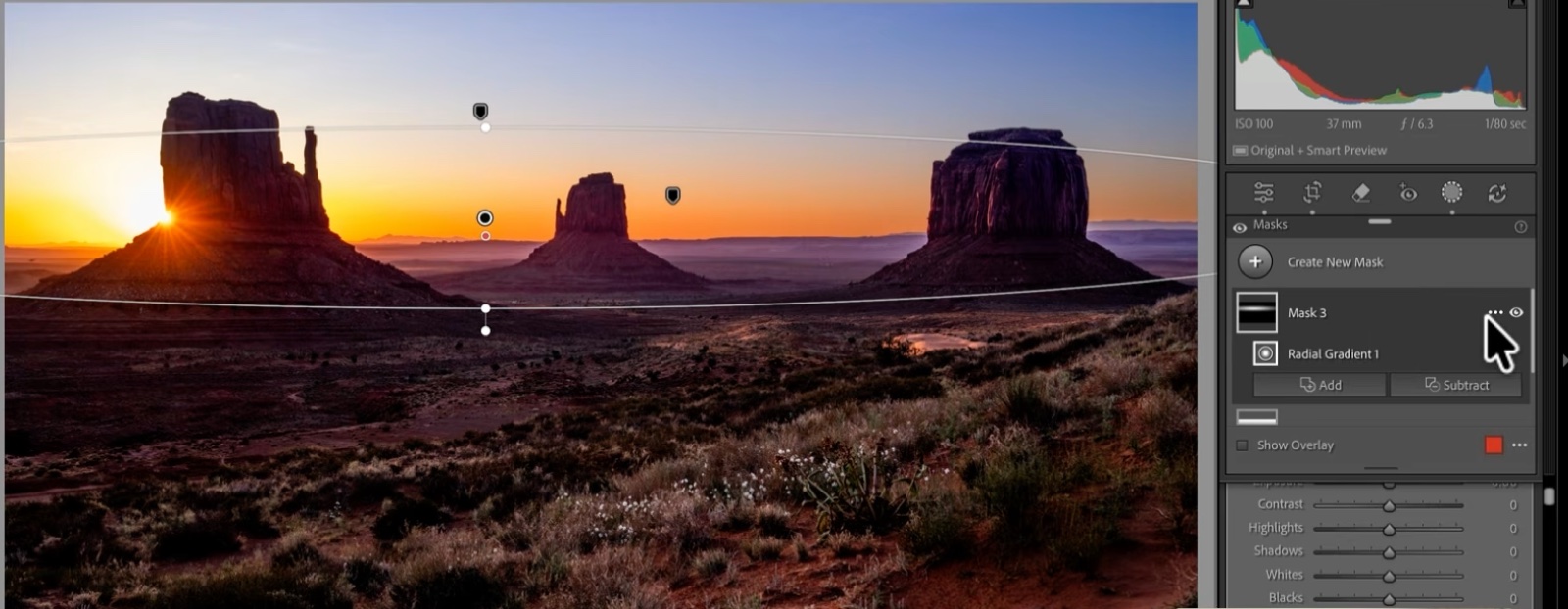 A radial gradient placed on the rising sun, still spilling onto the Mittens