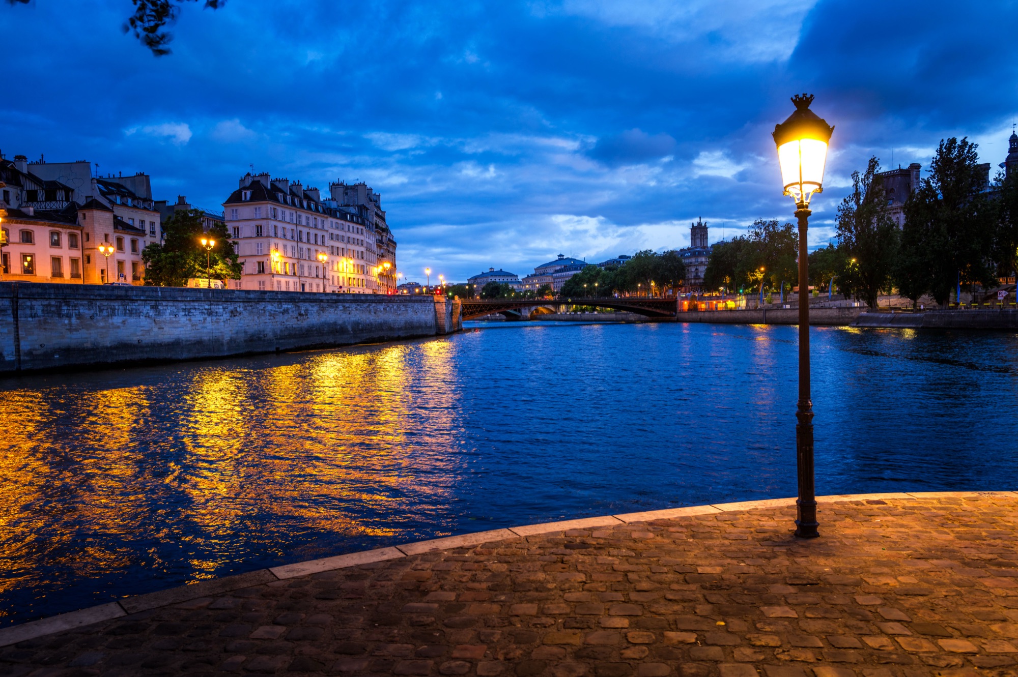After a Lightroom preset — Paris riverside lamp at blue hour with an AI Landscapes preset