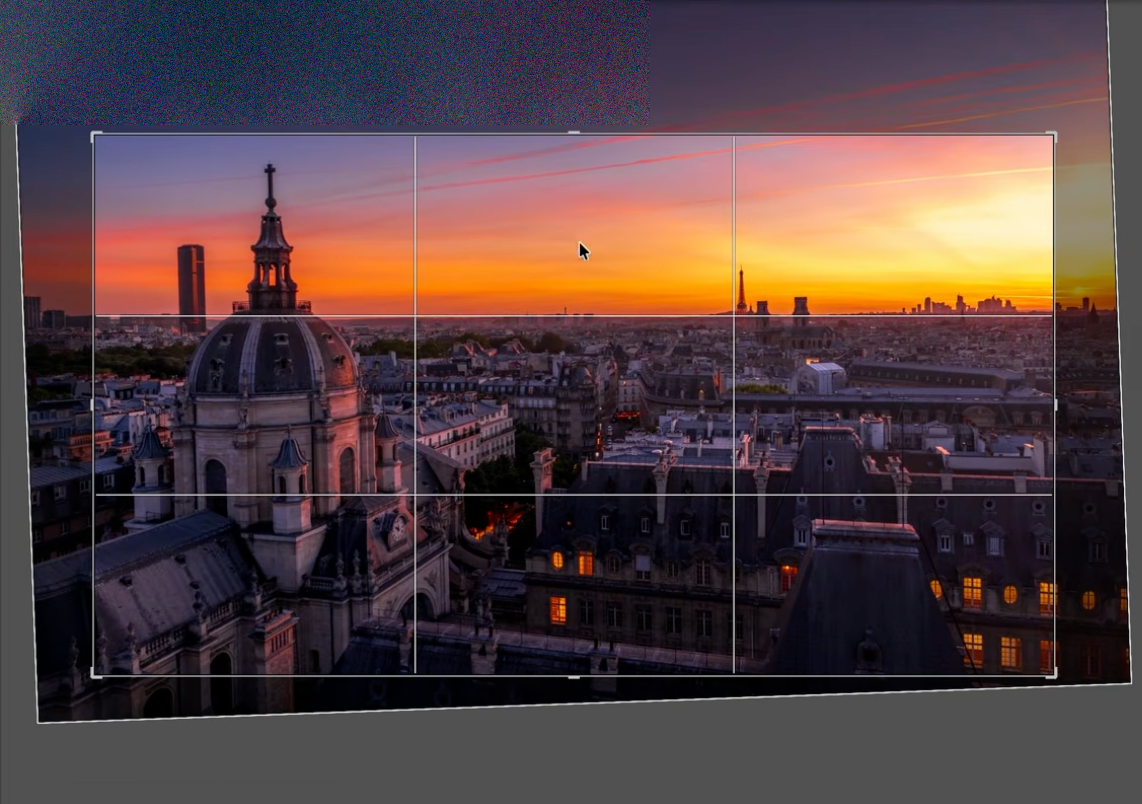 A rule-of-thirds grid over a Paris rooftop sunset, used to place the horizon and the dome in the frame