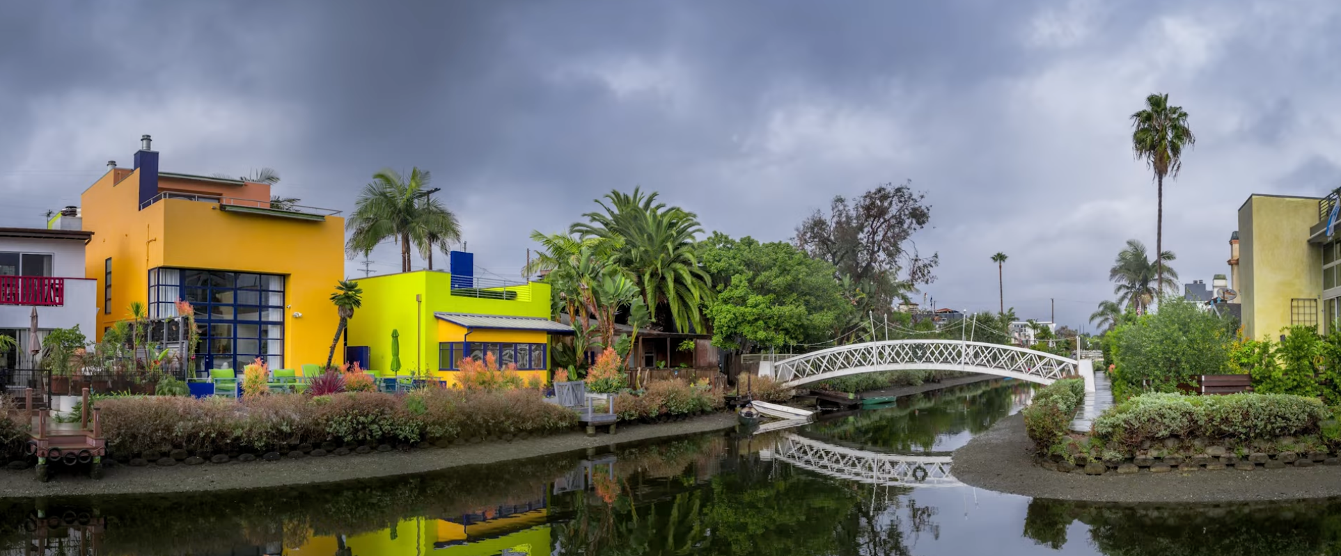 Retouched photo of a white arched footbridge over the Venice Canals