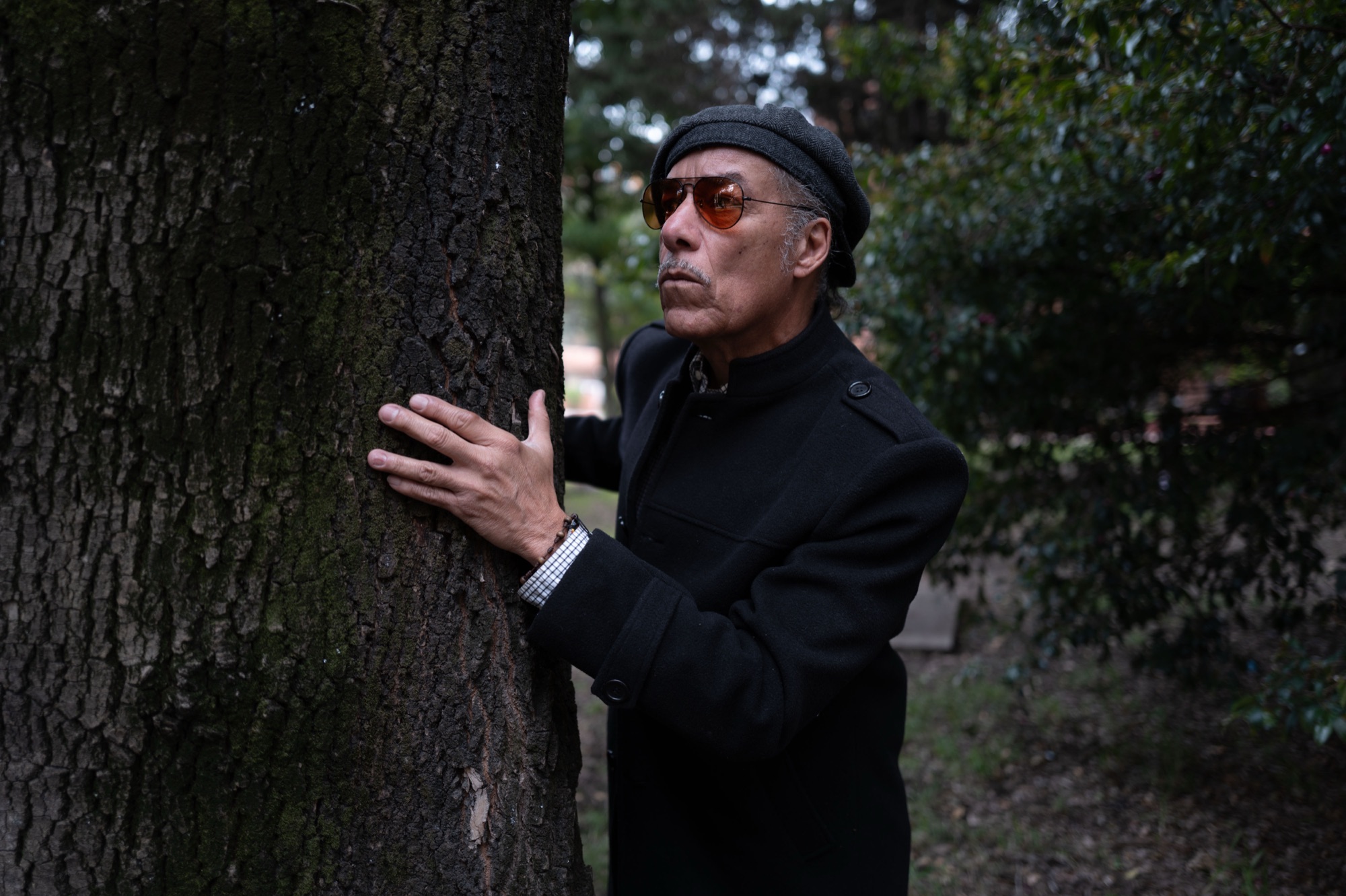 Before a black and white Lightroom preset — flat portrait of a man by a tree