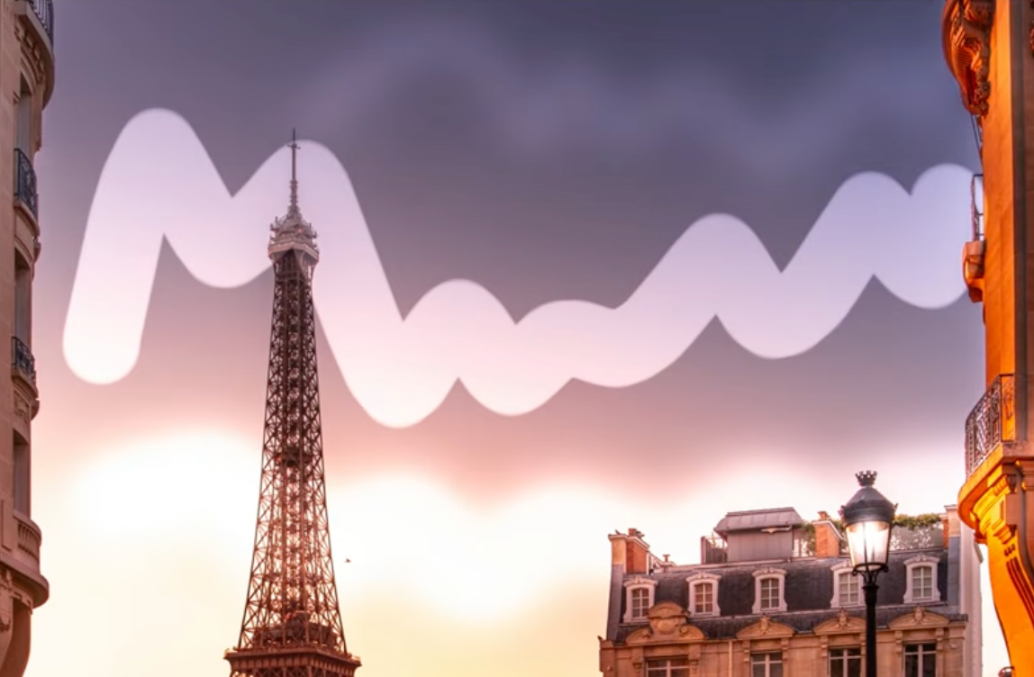 A brush mask stroke path traced across the sky above the Eiffel Tower for a Dodge and Burn adjustment in Lightroom