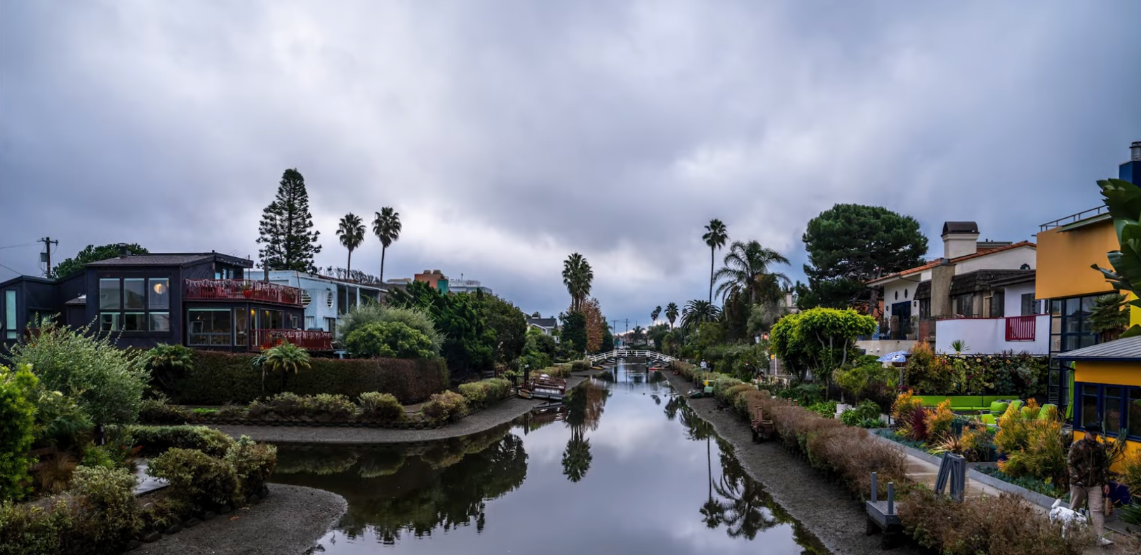 Retouched photo of the Venice Canals, colorful houses reflected in calm water