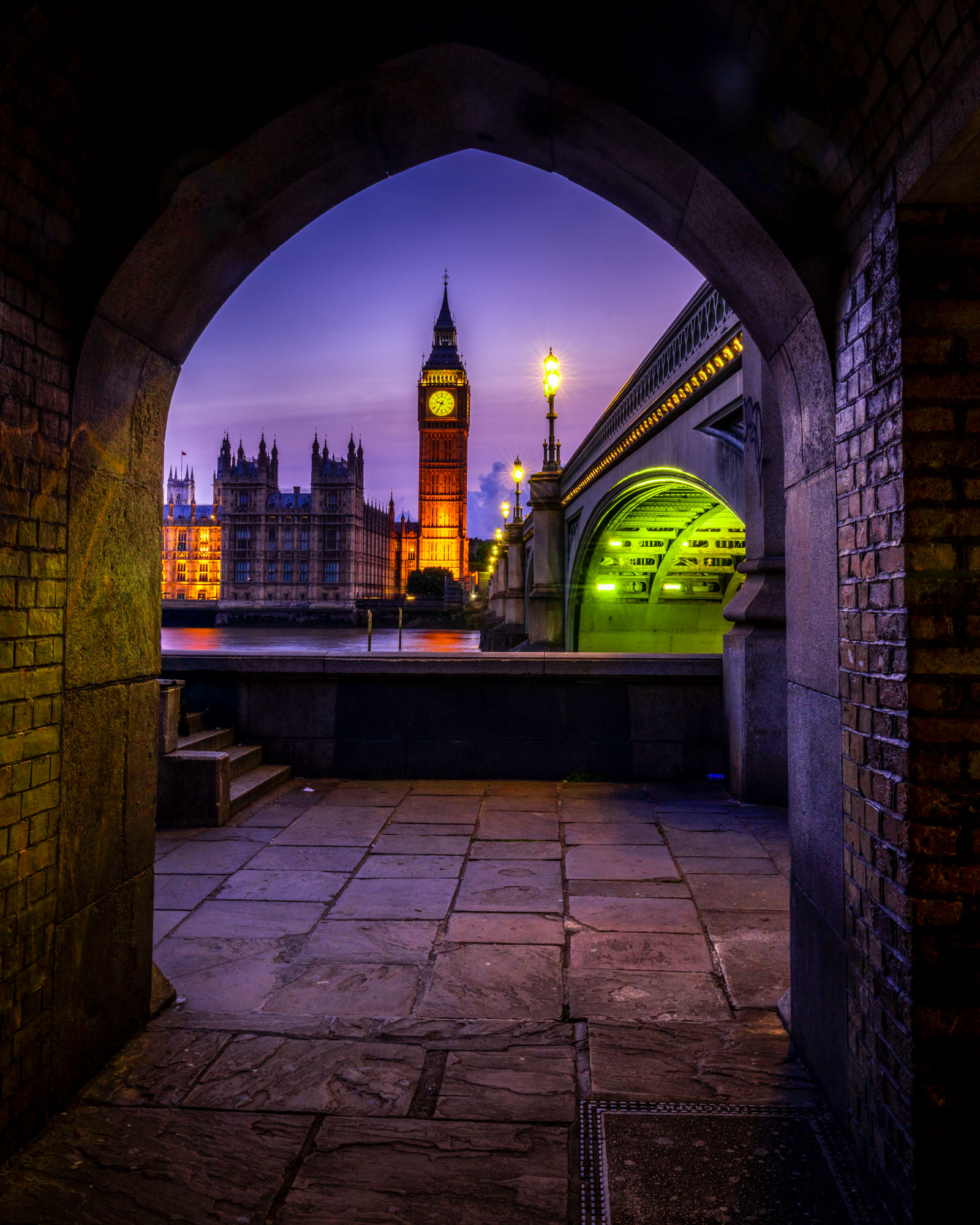 Big Ben framed through a stone arch at blue hour, 4 second long exposure at ISO 50 and f/22