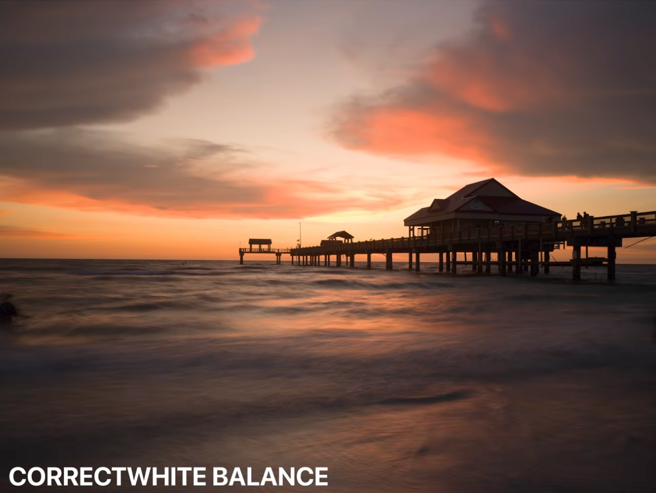 The same pier sunset photo with the correct, warm white balance