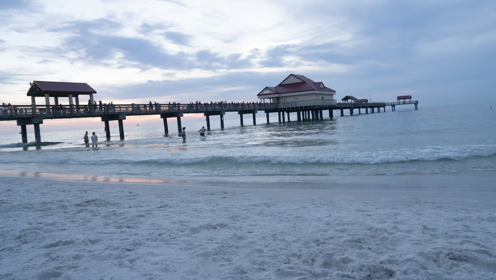 A sunset composition using wet sand as foreground interest