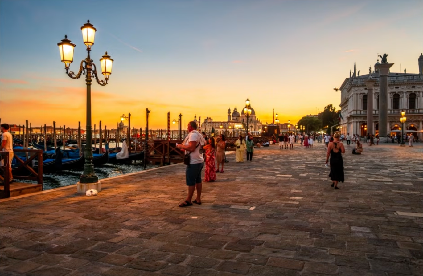 The same Venice promenade photo with the color grade applied but the crowd not yet removed