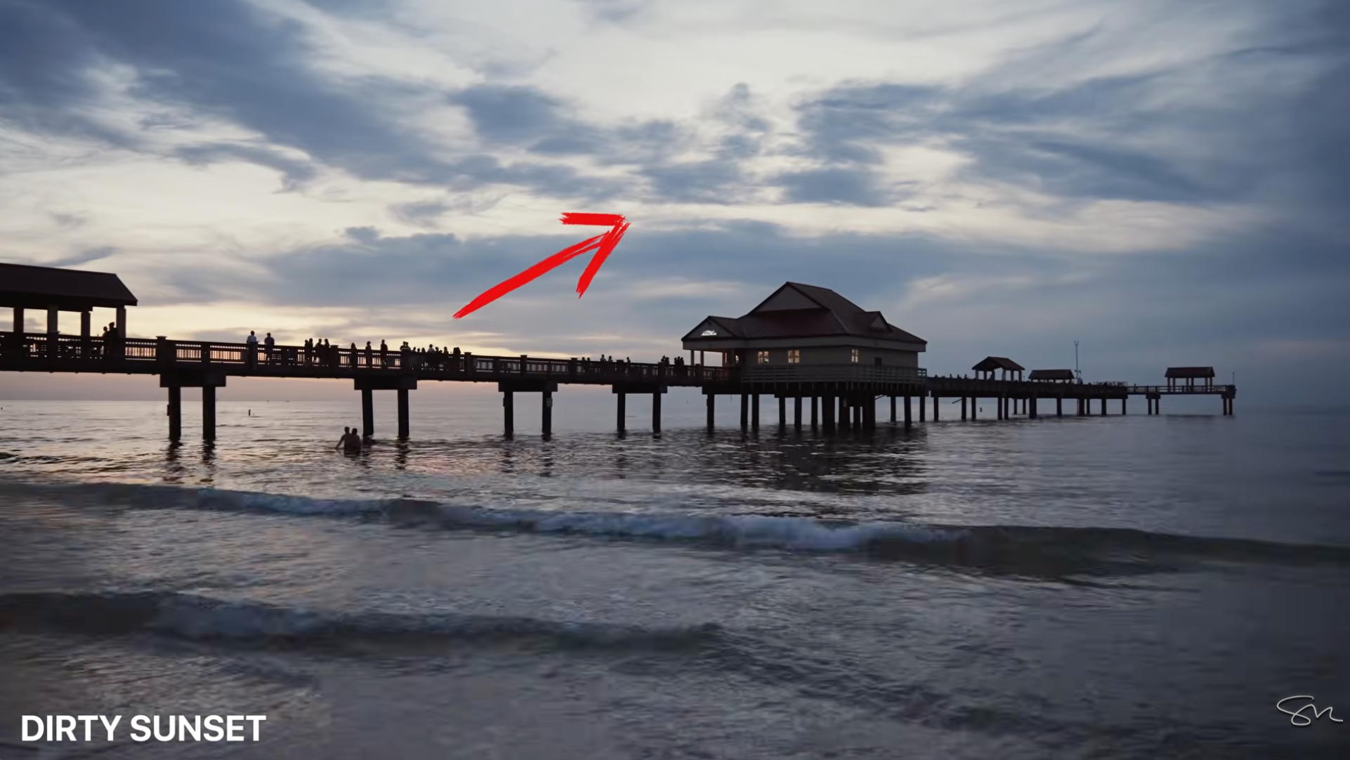 A dull, grey sunset sky over a pier, labeled DIRTY SUNSET, an example of a sky not worth waiting on