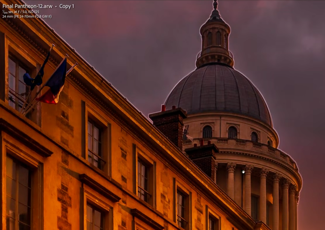 A visible halo tracing the edge of a dome and rooftop against a graded sky, the exact mistake this article is about