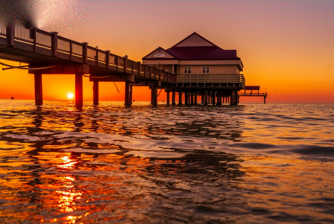 Harsh, choppy water at a pier at sunset, frozen at the wrong shutter speed