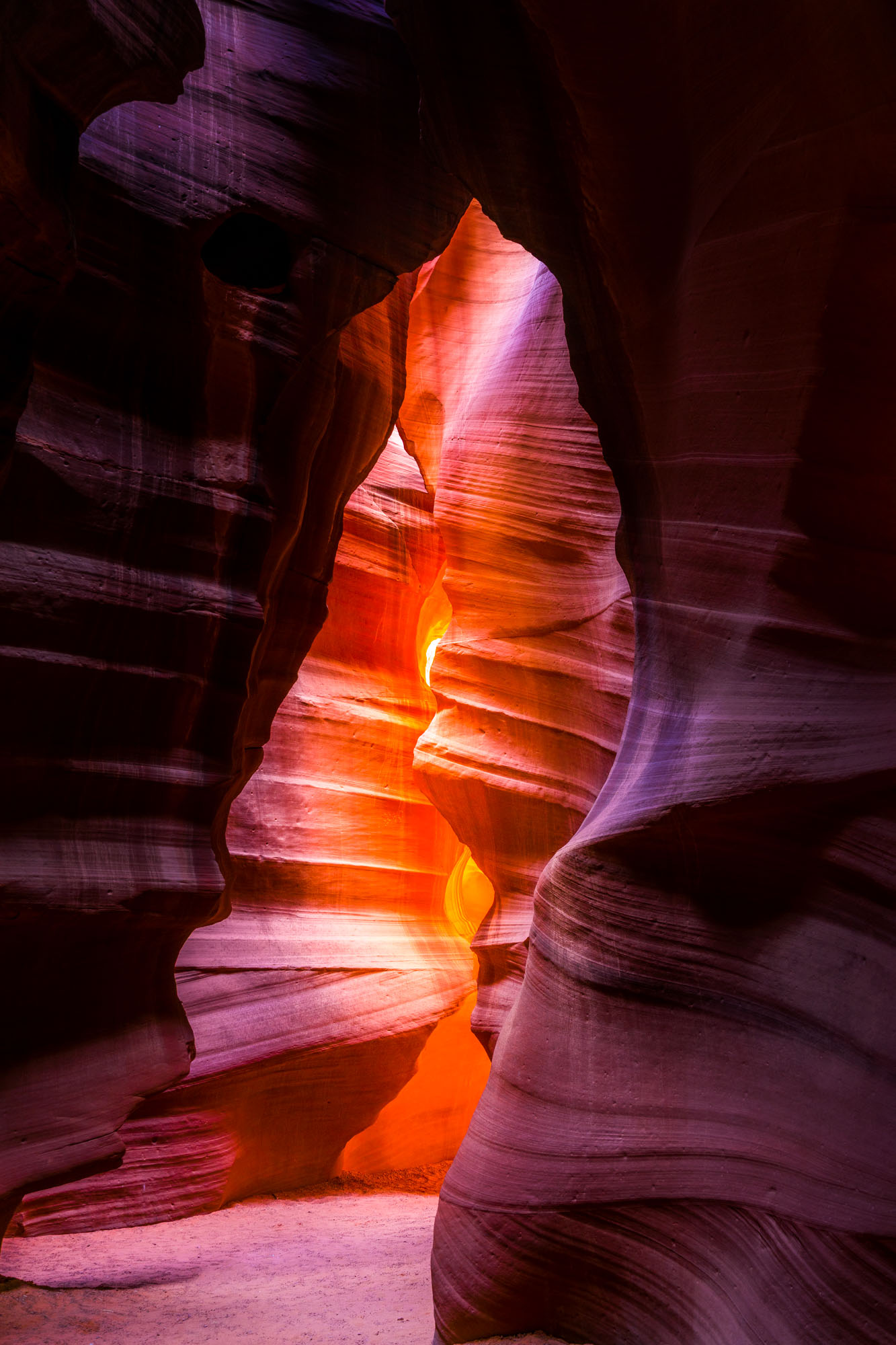 The Bear rock formation in Upper Antelope Canyon with purple and orange light