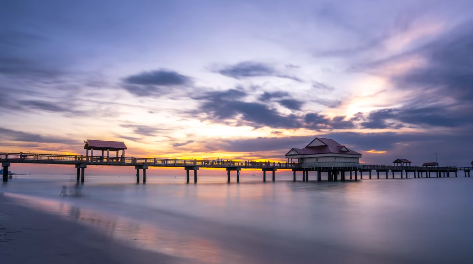 The same pier after a long exposure, with moving people blurred away entirely