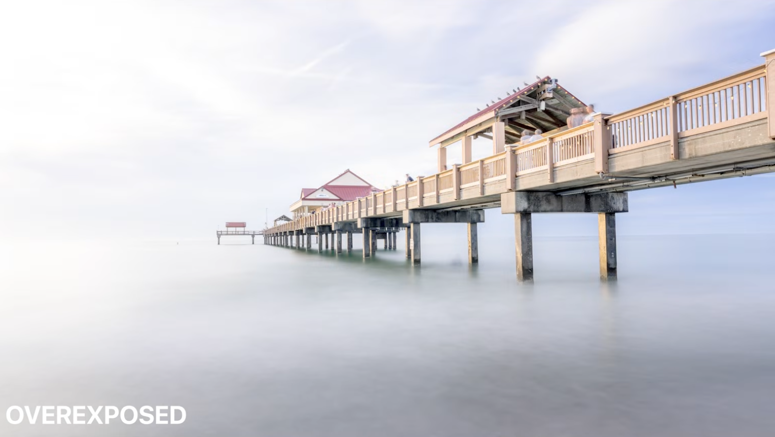 An overexposed version of the pier sunset photo with the sky washed out