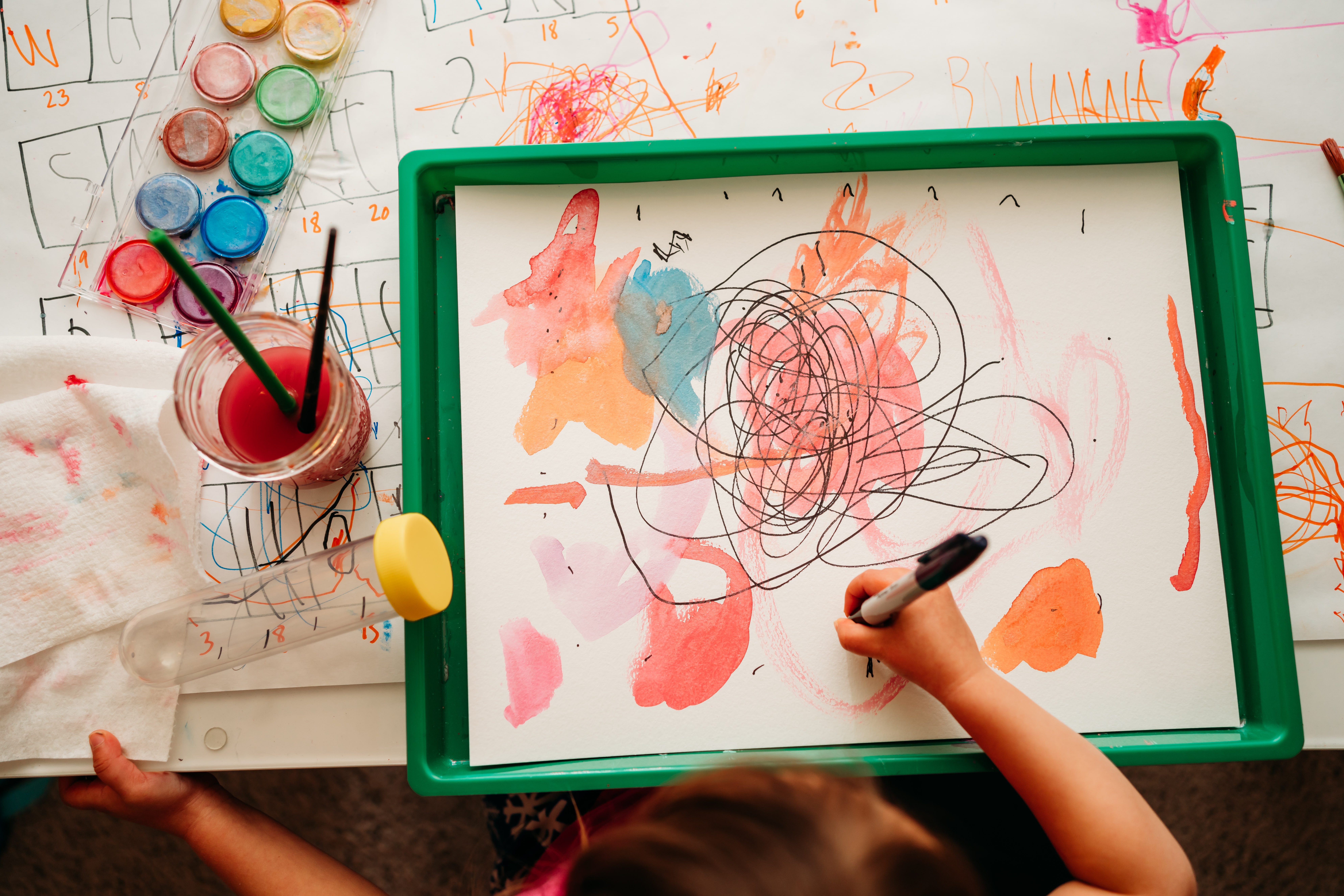 Child-led watercolor exploration photographed by Lori Starkey