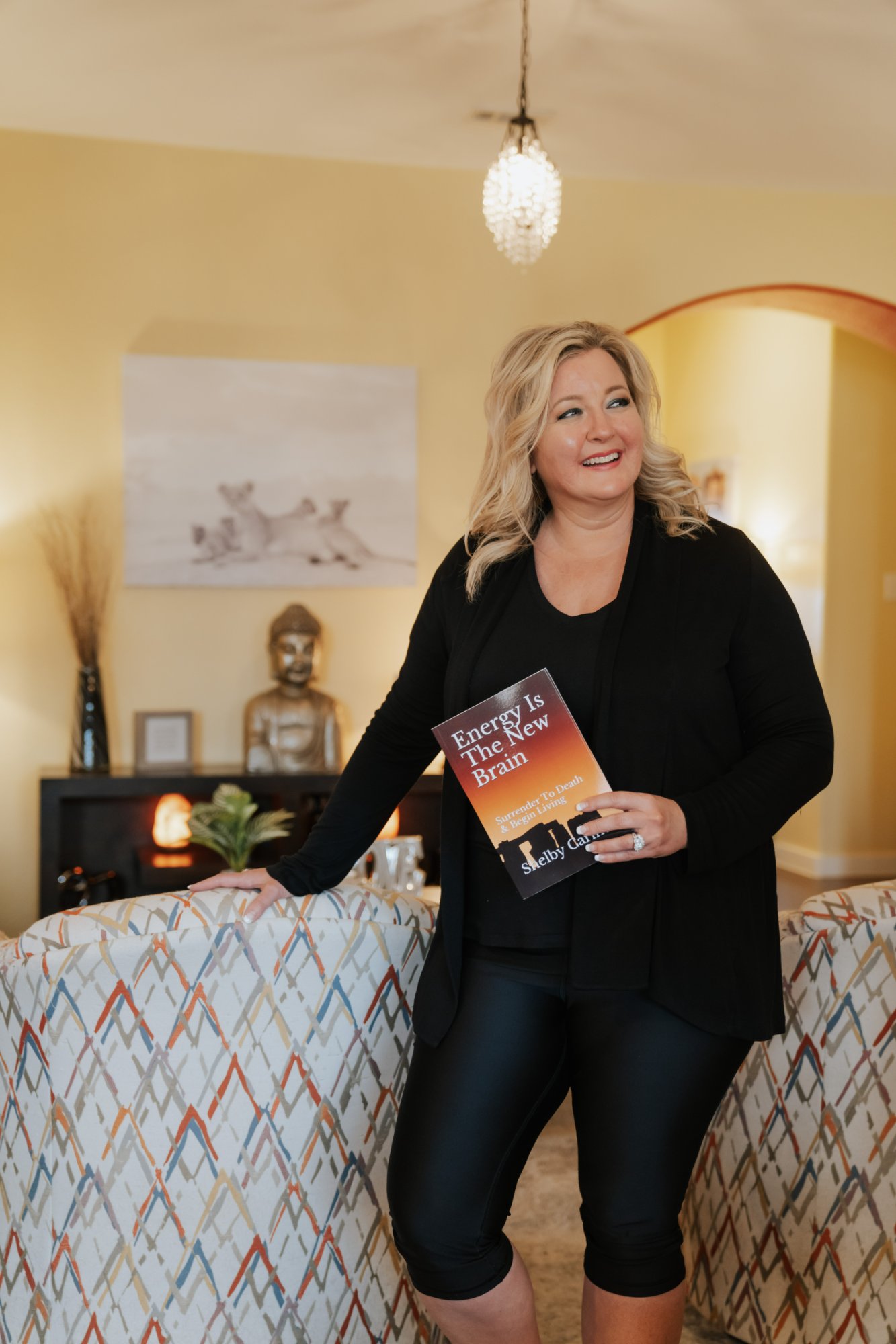 Shelby Carino holding her book