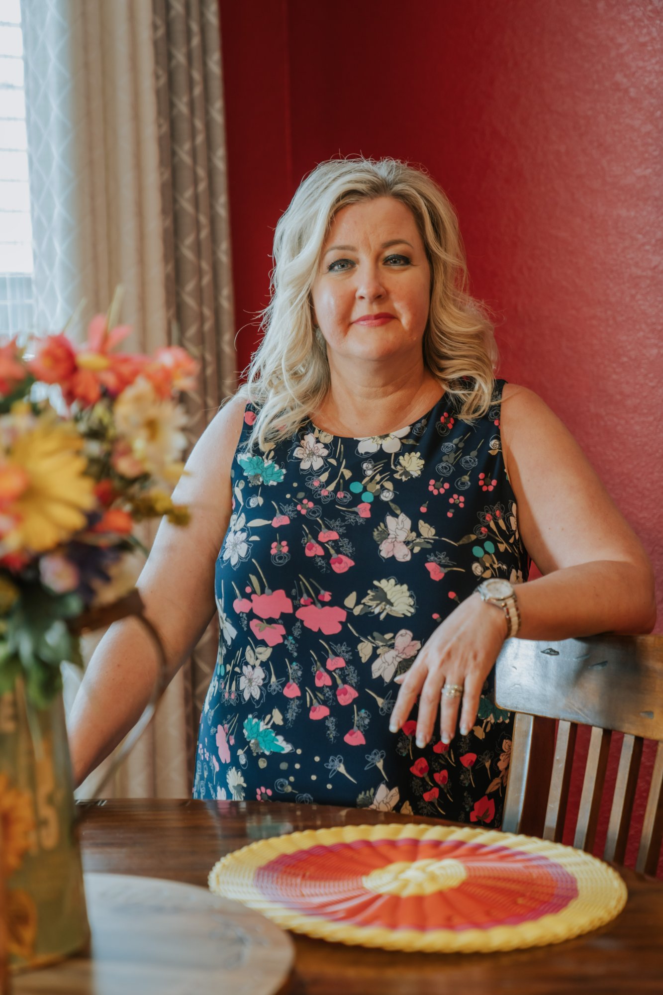 Shelby Carino seated at her dining room table