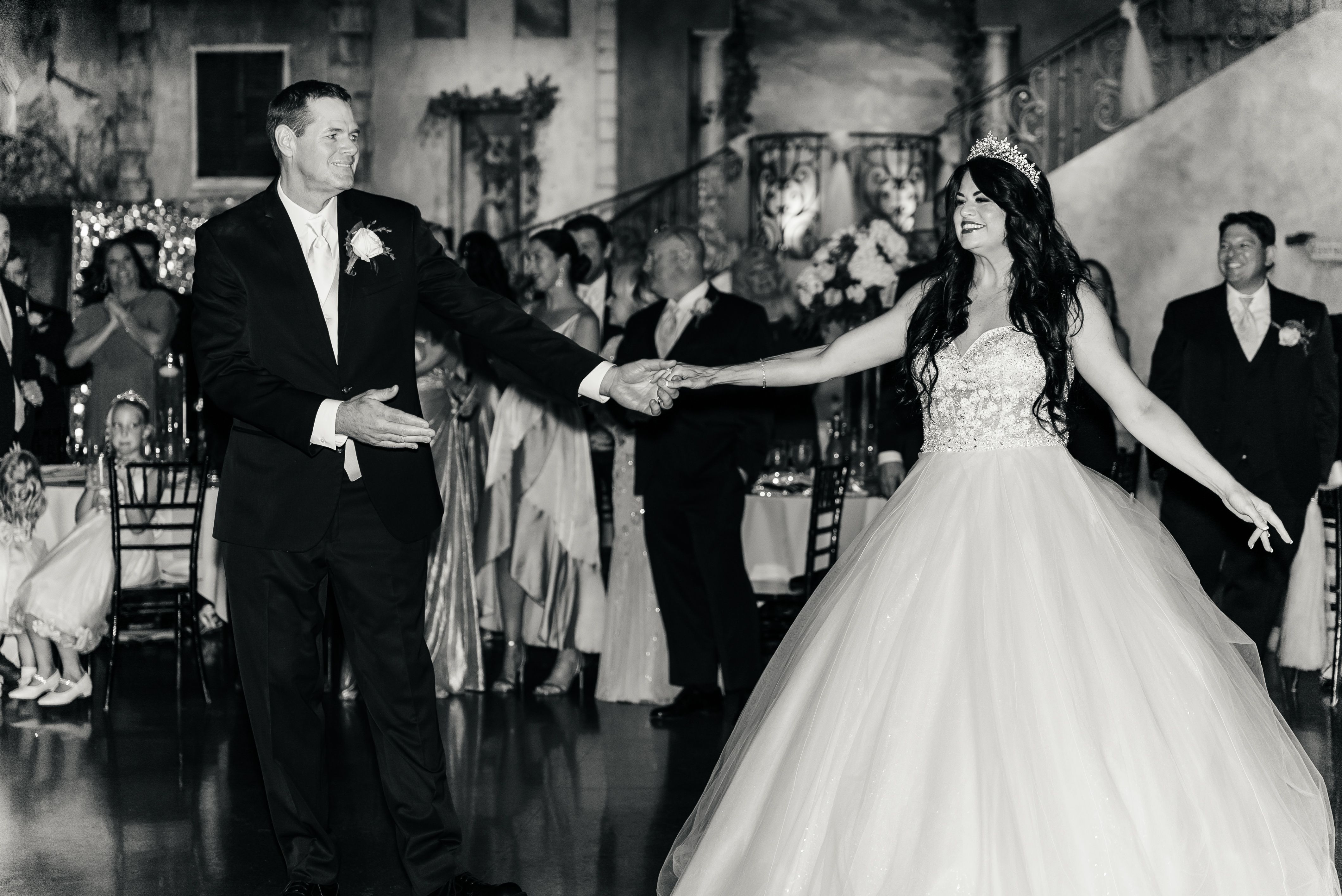 Melissa and Iain smiling at each other while dancing at their wedding