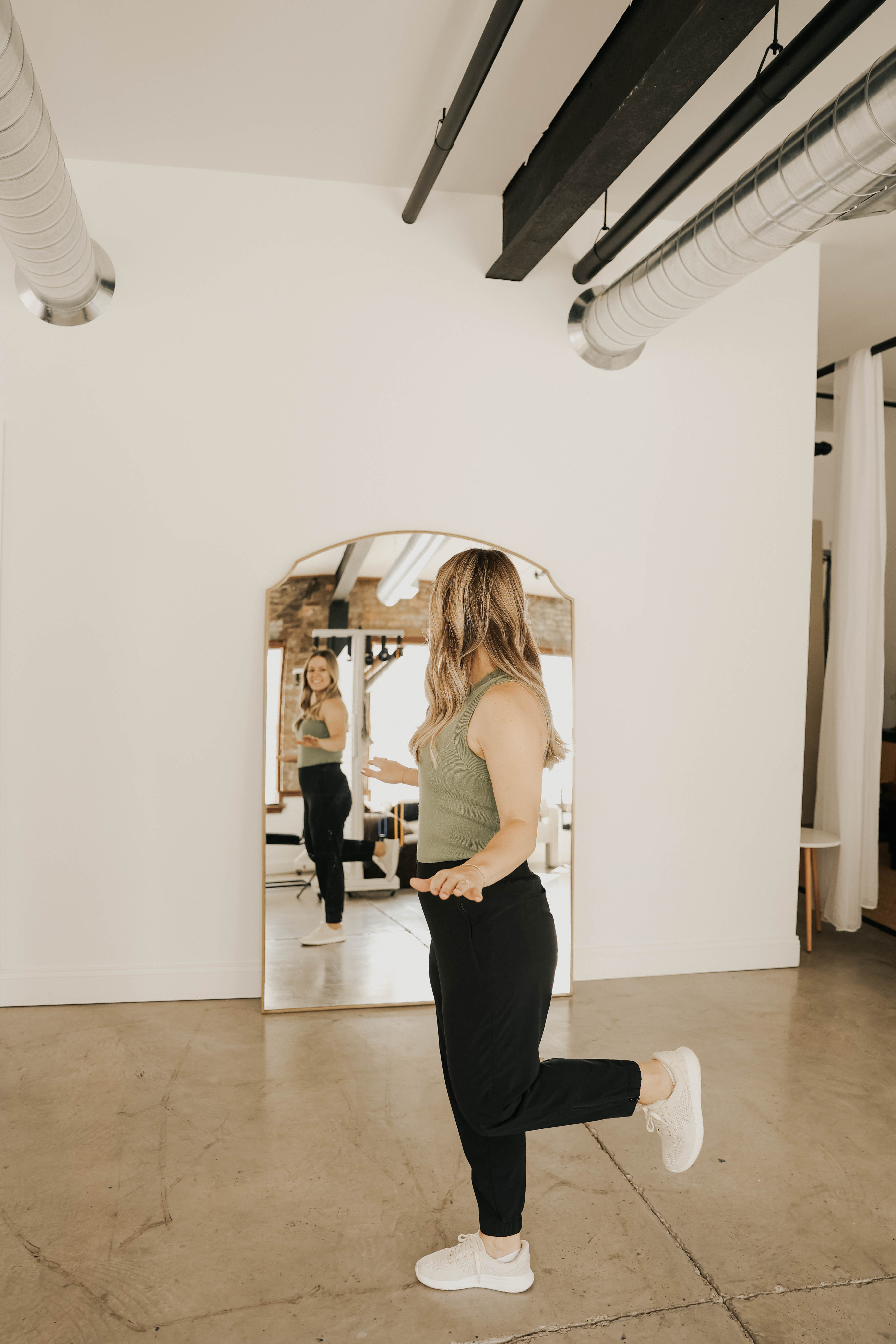 Dr. Gretchen Hawley marching in place in front of a mirror