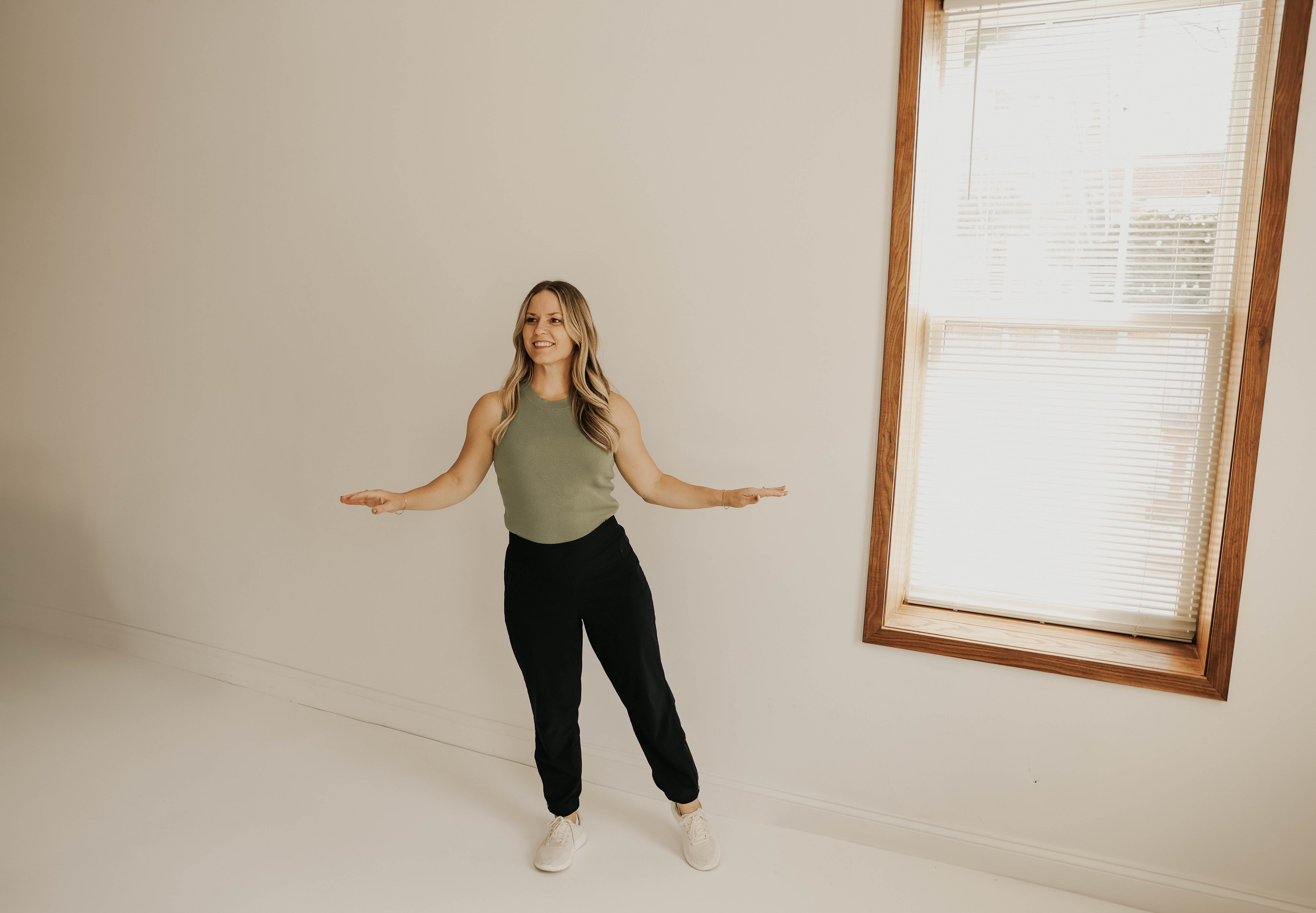 Dr. Gretchen Hawley standing with arms out, smiling
